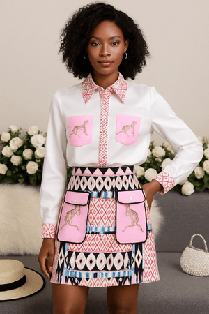 Fashionable two-piece set featuring a printed long-sleeved shirt and high-waisted skirt with unique designs.