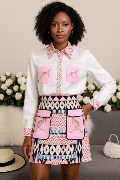 Fashionable two-piece set featuring a printed long-sleeved shirt and high-waisted skirt with unique designs.